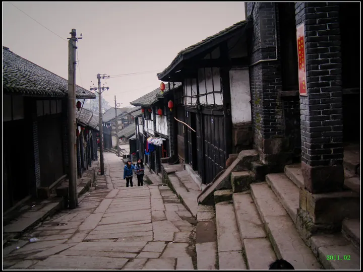 Old street with wooden buildings in Song Gai ancient town