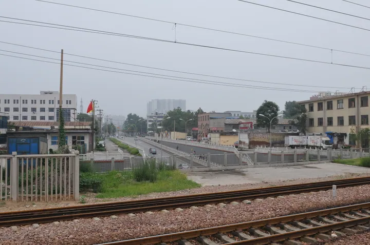 Street and railway line near Shijiazhuang North Railway Station in Xinhua District