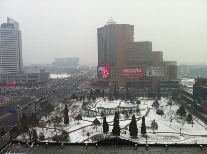 Elevated winter view of downtown Lubei District with a plaza and buildings