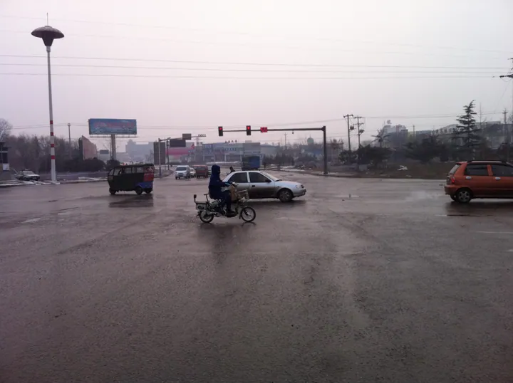 Street intersection with traffic in Guye District, Tangshan