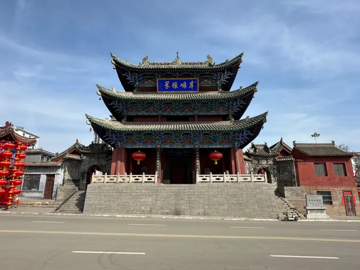 A traditional multi-tiered Chinese temple building with red lanterns, Licheng County
