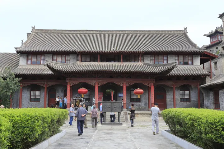 Traditional courtyard building with visitors outside, former residence of Yan Xishan, Dingxiang County
