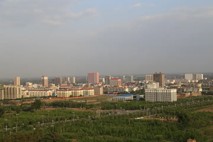 City skyline with high-rise buildings seen from a distance in Jiaocheng County