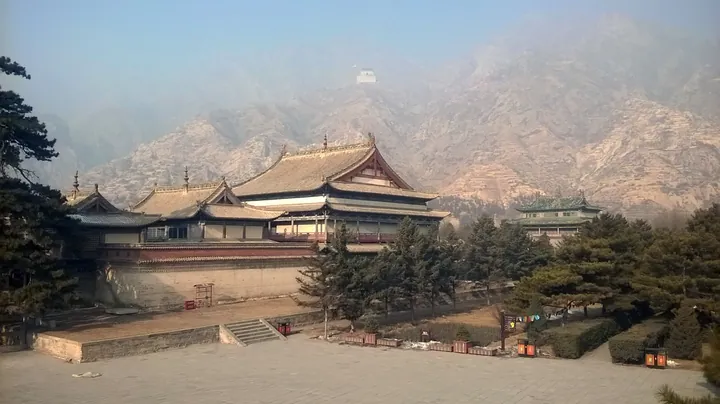 Temple halls with mountains behind, viewed from the walls of Meidaizhao, Tumed Right Banner