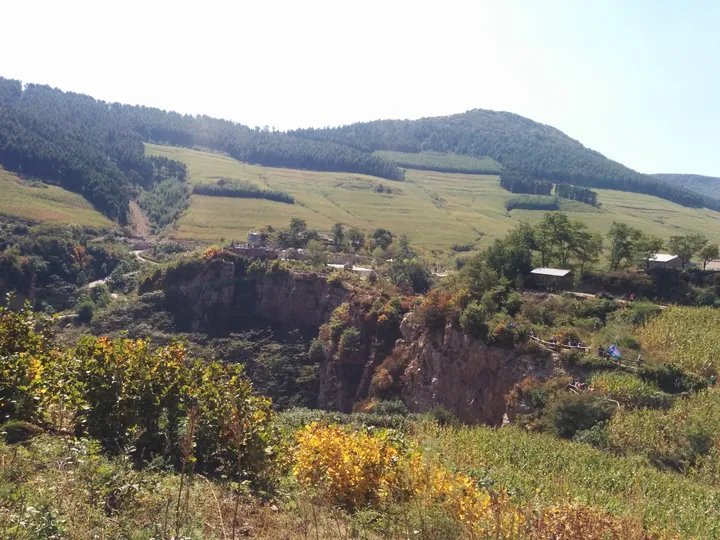 Rural canyon landscape with farmland and forest in Nanfen District