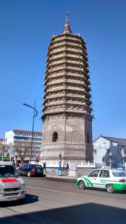Ancient brick pagoda on a town street in Nong'an