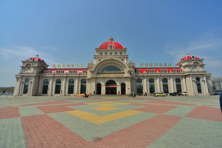 Grand red-domed passenger station building in Hunchun
