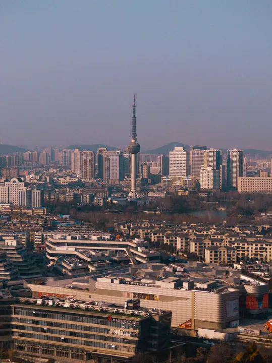 Xuzhou TV Tower rising above the city skyline, viewed from Yunlong Mountain