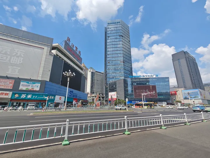 City-centre plaza in Huaiyin District with high-rise commercial buildings