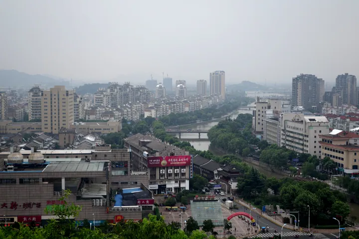A hazy birds-eye view of Yuyao's riverside urban area