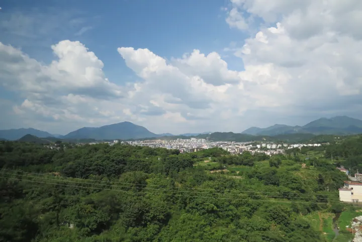 Distant view of Jingde county seat nestled among green hills