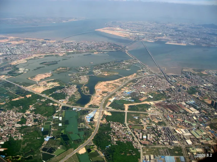 Aerial photo of Jimei District, Xiamen, showing coastline, bridges and the Garden Expo Park area