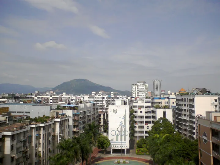 Skyline of Zhangzhou city in Xiangcheng District with a hill in the distance