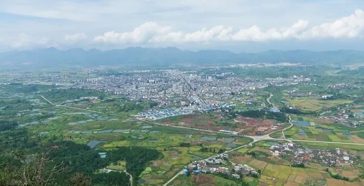 Wide aerial view of the town and surrounding farmland in Liancheng County