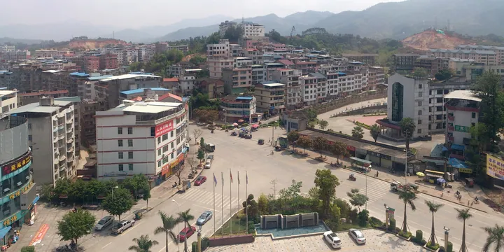 Elevated view of Zhangping city centre with a public square and surrounding buildings