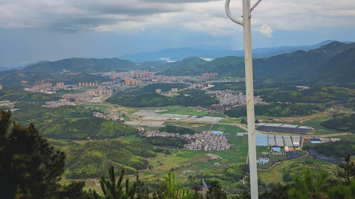 Elevated view of Zhouning county seat nestled among mountains and farmland