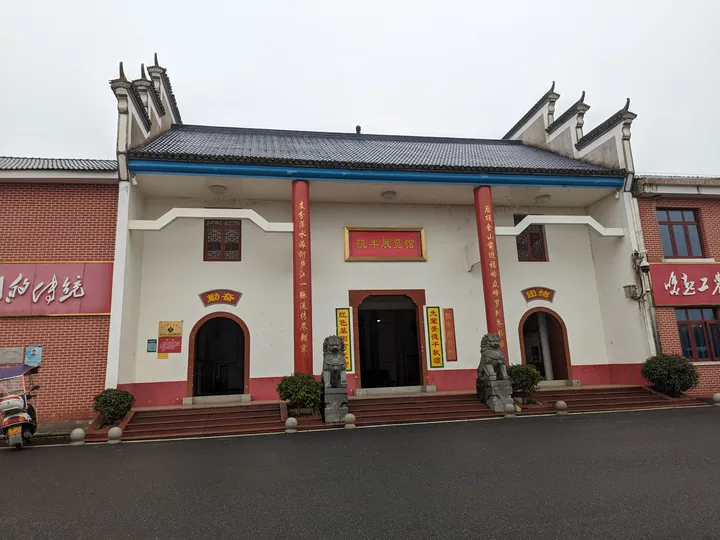 Red-brick exhibition hall building with Chinese banners in Xiangdong District