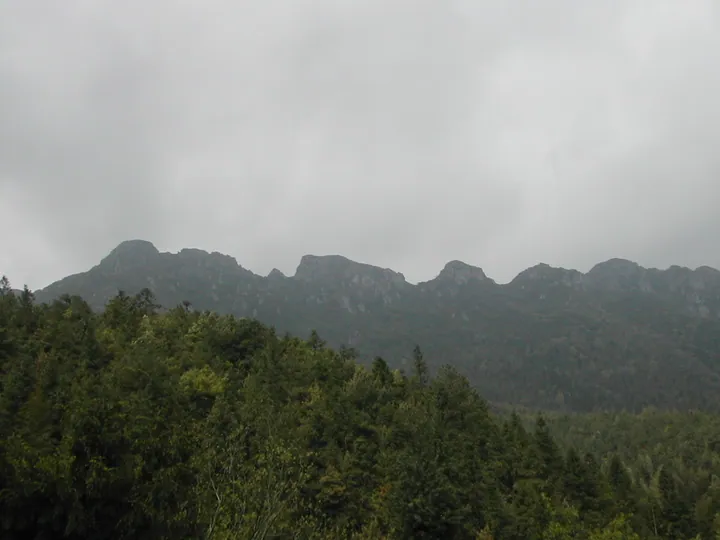 Misty ridge of Longzhanshan, a forested mountain in Xiushui County