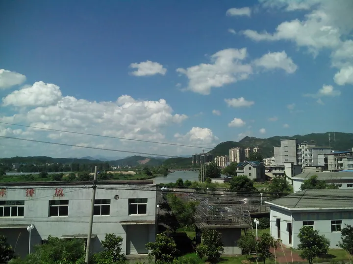 Hengfeng County townscape with river and hills
