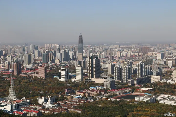 An aerial view of high-rise buildings and a television tower in Shizhong District, Jinan