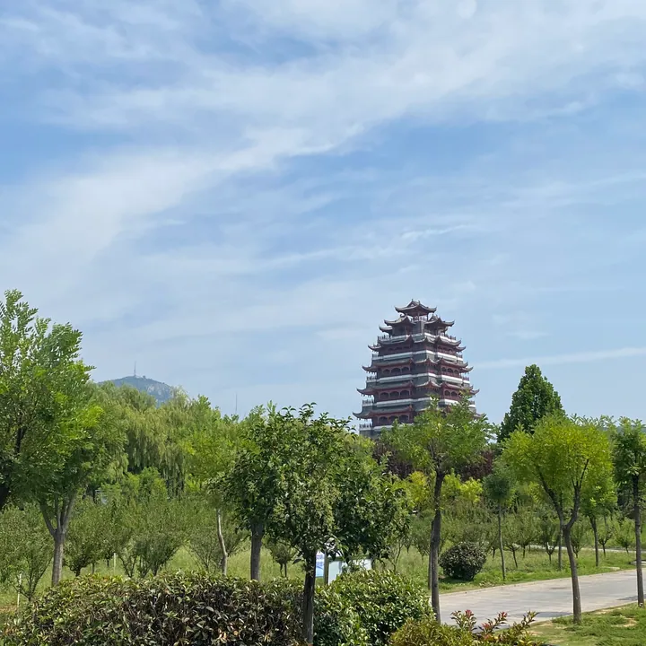 Traditional tower viewed through trees in Shanting District