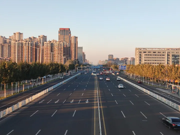 Wide boulevard with buildings at dusk on Bohai Road, Kuiwen District