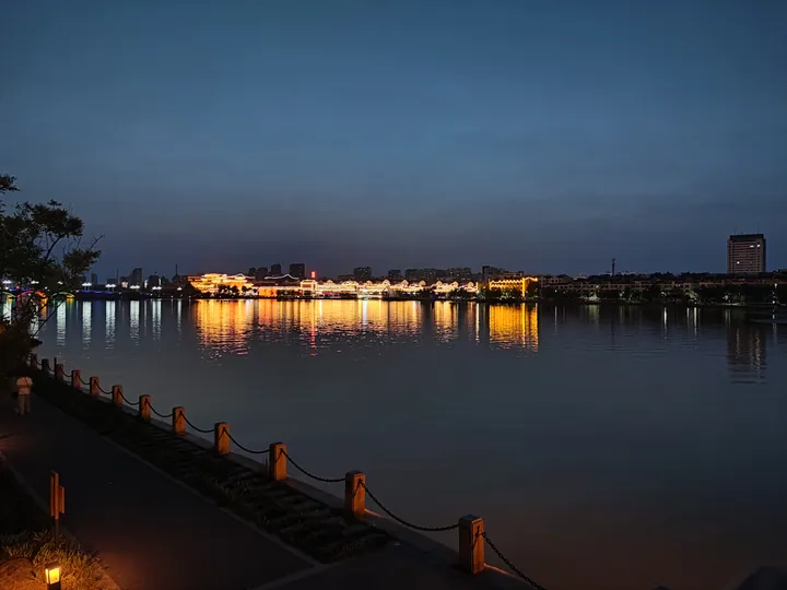 City skyline reflected on Dongchang Lake at night