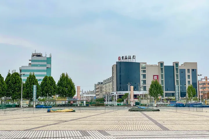 Open plaza with modern buildings in Huojia
