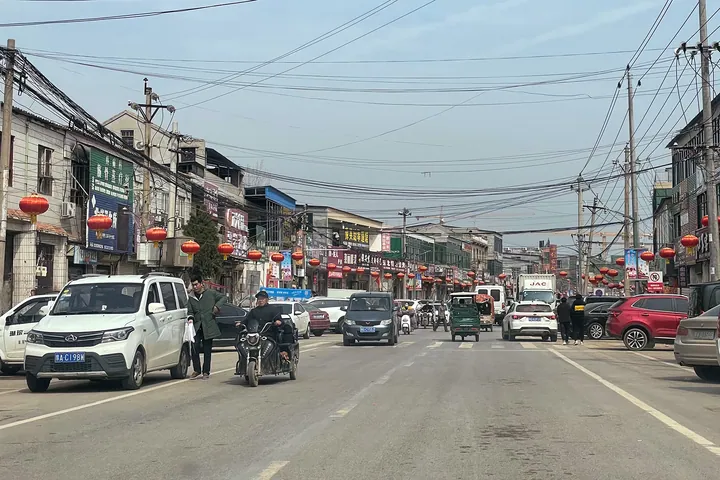 Busy town street decorated with red lanterns