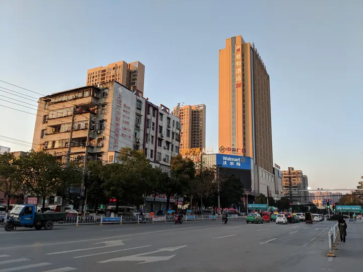 Street intersection in Yingcheng with a Walmart store and apartment towers