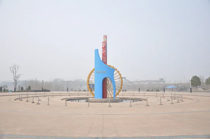 Modern sculpture in a park plaza in Anlu