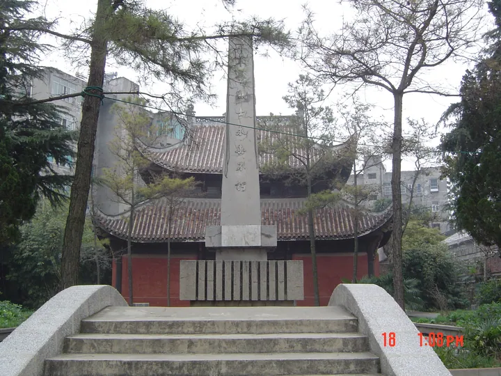 Traditional temple building with a stone stele in Gong'an County
