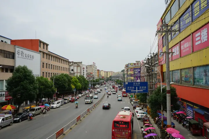 Downtown street viewed from a pedestrian overpass, Xishui County