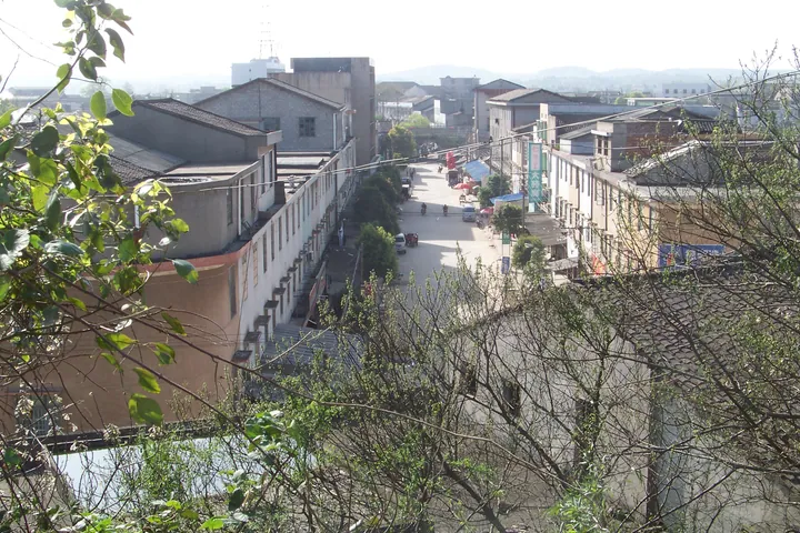 Elevated view of a small-town street with shops in Lukou District