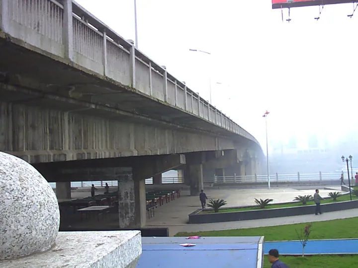 A hazy view of a river bridge and city skyline in Hengyang