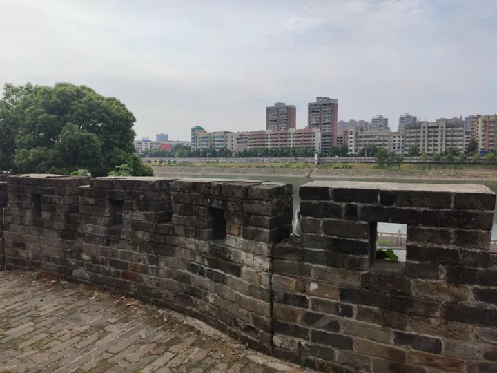 Ancient brick city wall overlooking the river and skyline of Shaoyang