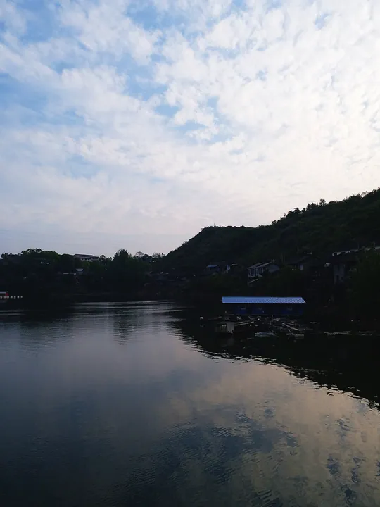 Yuan River and hillside settlement at dusk, Yuanling County