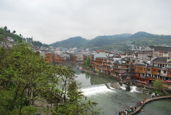 Riverside stilt houses and a weir on the Tuojiang River in Fenghuang Ancient Town
