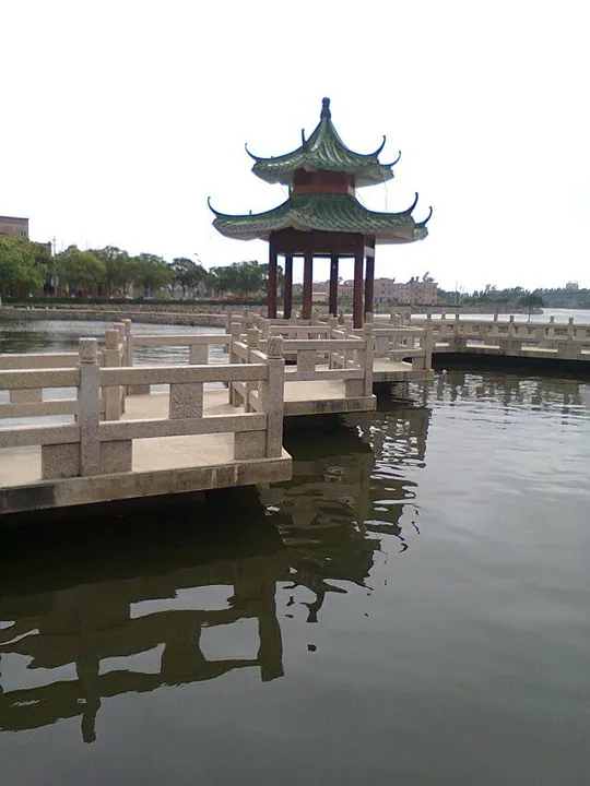 Chinese-style pavilion on a stone bridge over water in Wuchuan