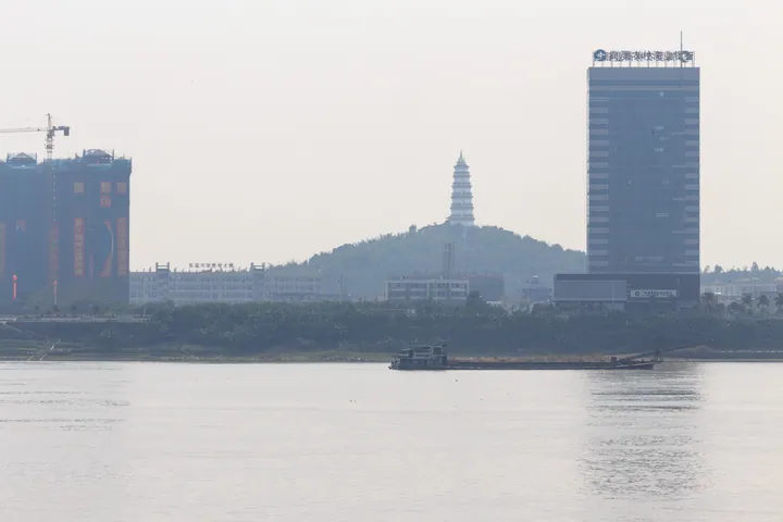 Wenming Pagoda on a hill above the Xi River, seen from across the water in Gaoyao District