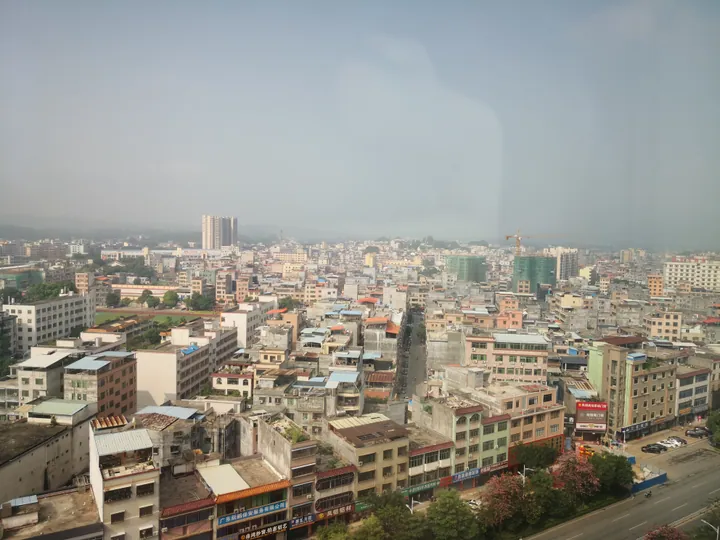 Dense townscape of low-rise buildings seen from above in Yonghan Town, Longmen County