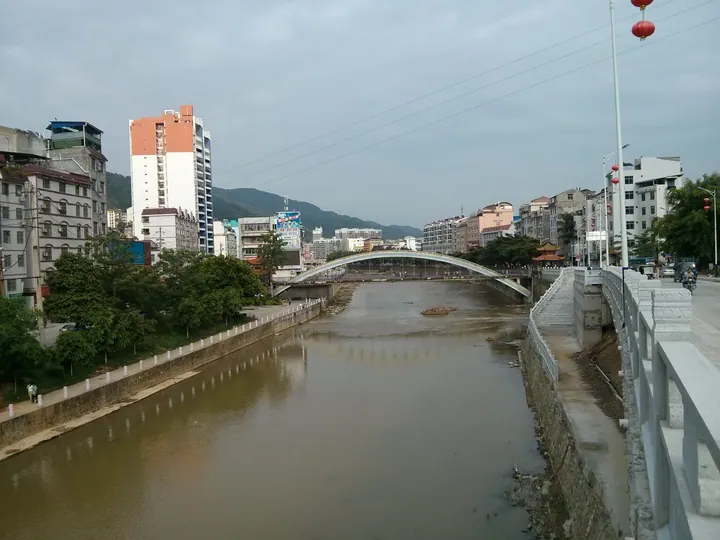 Arched bridge over a river in Tianlin County town