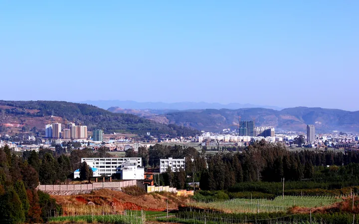 Farmland and the town of Chengjiang seen from a hillside road