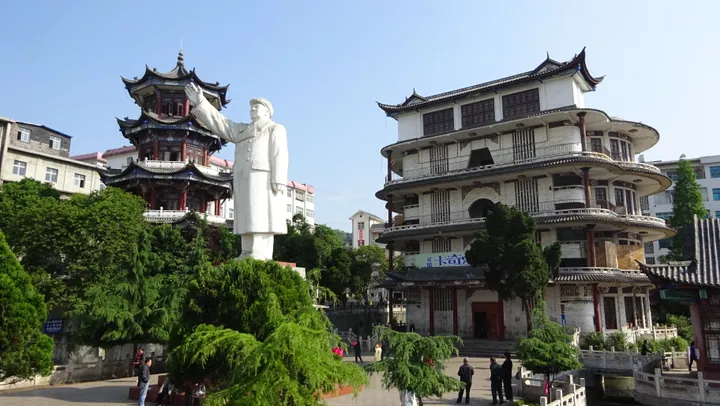 Pagoda and large statue at Zhenxiong People's Park in Zhenxiong County