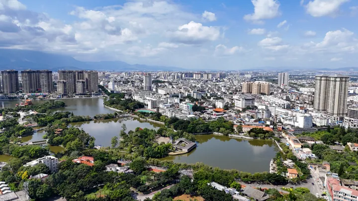 Aerial cityscape of Mengzi around South Lake