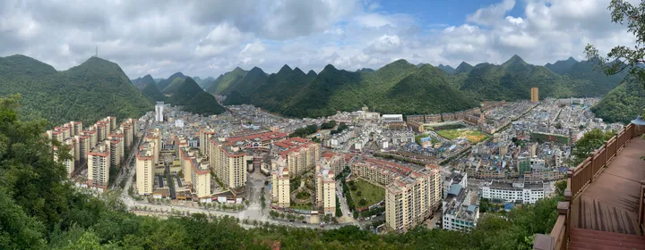 Panoramic view of Xichou County town amid karst peaks