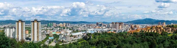 Wide panorama of the Xiangyun county seat surrounded by hills