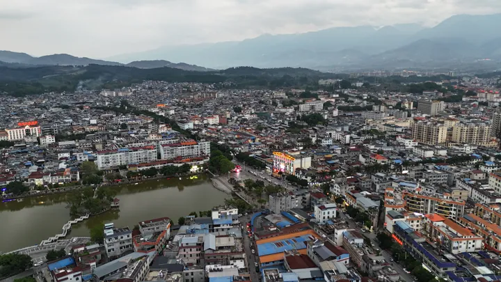 Aerial cityscape of Yingjiang with a river running through town