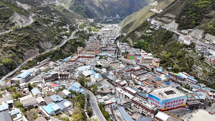 Aerial view of Deqin town set in a steep mountain valley