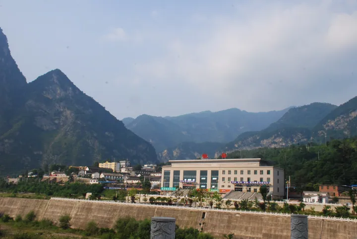 Station building of Huixian Railway Station amid mountains